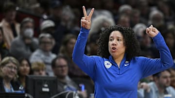 Mar 30, 2024; Portland, OR, USA; Duke Blue Devils head coach Kara Lawson calls out a signal during the second half against the UConn Huskies in the semifinals of the Portland Regional of the 2024 NCAA Tournament at the Moda Center. Mandatory Credit: Troy Wayrynen-Imagn Images