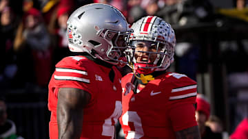 Ohio State Buckeyes wide receiver Emeka Egbuka (2) celebrates a touchdown by wide receiver Jeremiah Smith (4) during the NCAA football game against the Michigan Wolverines at Ohio Stadium in Columbus on Tuesday, Dec. 3, 2024. Michigan won 13-10.