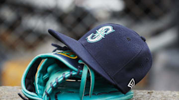 May 12, 2018; Detroit, MI, USA; Hat and glove of Seattle Mariners center fielder Dee Gordon (9) sits in dugout during the third inning against the Detroit Tigers at Comerica Park. Mandatory Credit: Rick Osentoski-Imagn Images