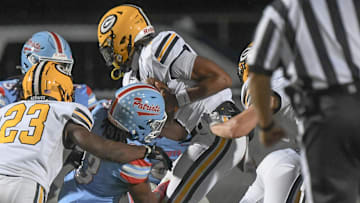 Greenwood quarterback Triston Lewis ran in for a one-yard touchdown play during the first quarter at JL Mann High in Greenville, S.C. Tuesday, Oct 22, 2024.