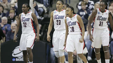 Mar 22, 2009; Storrs, CT, USA; Connecticut Huskies (L-R) guard Kalana Greene (32), forward Maya Moore (23), guard Renee Montgomery (20) and center Tina Charles (31) return to their bench during a timeout as they take on the Vermont Catamounts during the second half of the first round in the 2009 NCAA womens basketball tournament at Gampel Pavilion. UConn defeated Vermont 104-65. Mandatory Credit: David Butler II-Imagn Images