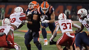 Oct 6, 2023; Champaign, Illinois, USA; Illinois Fighting Illini running back Kaden Feagin (3) runs through an opening in the Nebraska Cornhuskers defense during the first half at Memorial Stadium. Mandatory Credit: Ron Johnson-Imagn Images