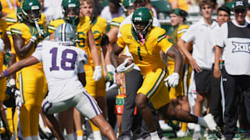 Oct 4, 2025; Waco, Texas, USA;  Baylor Bears tight end Michael Trigg (1) runs after the catch against Kansas State Wildcats safety Wesley Fair (18) during the first half at McLane Stadium. Mandatory Credit: Chris Jones-Imagn Images