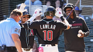 Arizona Diamondbacks Jordan Lawlar celebrates with Gabriel Moreno and Geraldo Perdomo after hitting a two-run home run off Milwaukee Brewers pitcher Tyler Alexander in the second inning of a spring training game on Feb. 26, 2025, in Scottsdale at Salt River Fields at Talking Stick.