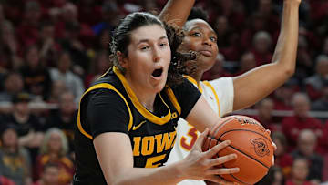 Iowa Hawkeyes center Ava Heiden (5) drives to the basket around Iowa State Cyclones' forward Alisa Williams (3) during the first quarter in the NCAA women’s basketball Cy-Hawk Series on Dec. 10, 2025, at Hilton Coliseum in Ames, Iowa.