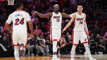 Dec 1, 2025; Miami, Florida, USA; Miami Heat center Bam Adebayo (13), guard Norman Powell (24) and guard Tyler Herro (14) get back on defense against the Los Angeles Clippers during the second half at Kaseya Center. Mandatory Credit: Jim Rassol-Imagn Images