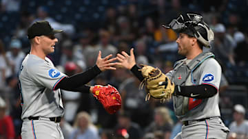 Jun 10, 2025; Pittsburgh, Pennsylvania, USA;  Miami Marlins starting pitcher Sandy Alcantara (left) celebrates a victory over the Pittsburgh Pirates with catcher Augustin Ramirez at PNC Park. Mandatory Credit: Philip G. Pavely-Imagn Images