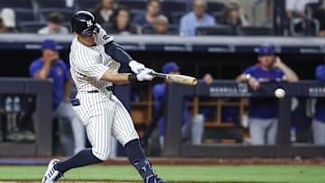 Jul 11, 2025; Bronx, New York, USA;  New York Yankees shortstop Anthony Volpe (11) hits an RBI double in the sixth inning against the Chicago Cubs at Yankee Stadium. Mandatory Credit: Wendell Cruz-Imagn Images