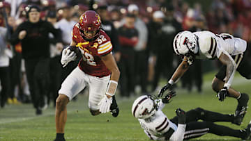 Iowa State Cyclones wide receiver Carson Brown (32) breaks a tackle from Texas Tech defenders and runs for a touchdown during the fourth quarter in the week-10 NCAA football at Jack Trice Stadium on Saturday, Nov. 2, 2024, in Ames, Iowa.