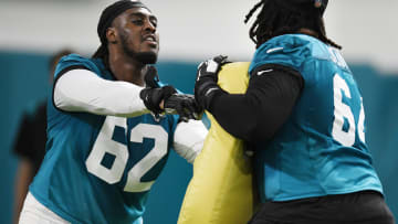 Jacksonville Jaguars offensive tackle Javon Foster (62) goes up against offensive lineman Steven Jones during drills at Friday's rookie minicamp. The Jacksonville Jaguars held their first day of rookie minicamp inside the covered field at the Jaguars performance facility in Jacksonville, Florida Friday, May 10, 2024.