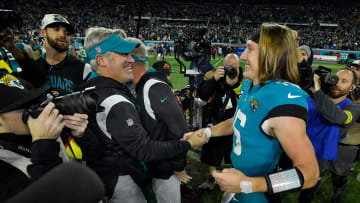 Jacksonville Jaguars head coach Doug Pederson and Jacksonville Jaguars quarterback Trevor Lawrence (16) greet each other after Saturday night's victory over the Tennessee Titans, clinching the AFC South title. The Jacksonville Jaguars hosted the Tennessee Titans to decide the AFC South championship at TIAA Bank Field in Jacksonville, FL, Saturday, January 7, 2023. The Jaguars went into the half trailing 7 to 13 but came back to win with a final score of 20 to 16. [Bob Self/Florida