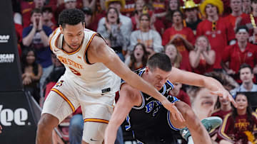 Iowa State Cyclones forward Joshua Jefferson (2) and BYU Cougars's forward Mihailo Boskovic (5) battle for a loose ball during the first over-time of the Big-12 men’s basketball in the Senior Day at Hilton Coliseum on March 4, 2025, in Ames, Iowa.