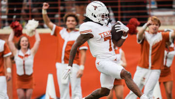 April 20, 2024; Austin, Texas, USA: Texas White wide receiver Isaiah Bond runs the ball in to score a touchdown during the fourth quarter of the Longhorns' spring Orange and White game at Darrell K Royal Texas Memorial Stadium. Mandatory Credit: Sara Diggins-USA Today Sports via American Statesman