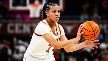Texas Longhorns guard Jordan Lee (7) passes to a teammate in the first half as the Texas Longhorns take on the Vanderbilt Commodores at the Moody Center, Feb. 5, 2025.