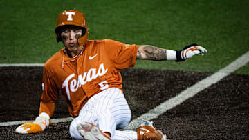 Texas Longhorns infielder Ethan Mendoza (5) slides home to score the first run of the game for the Longhorns in the first inning as the Texas Longhorns take on the University of the Incarnate Word Cardinals at UFCU Disch-Falk Field in Austin, Feb. 25, 2025.