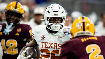 Texas Longhorns running back Quintrevion Wisner (26) runs the ball in the second quarter as the Texas Longhorns play the Arizona State Sun Devils in the Peach Bowl College Football Playoff quarterfinal at Mercedes-Benz Stadium in Atlanta, Georgia, Jan. 1, 2025.