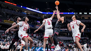 USC Trojans guard goes up for a basket in the lane against the Rutgers Scarlet Knights Forward
