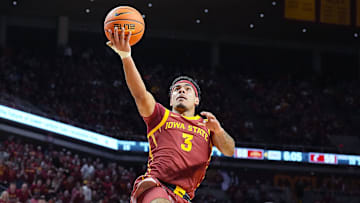 Iowa State Cyclones guard Tamin Lipsey (3) goes for a layup around Cincinnati Bearcats' guard Day Day Thomas (1) during the second half in the Big-12 men’s basketball at Hilton Coliseum on Feb. 15, 2025 in Ames, Iowa.