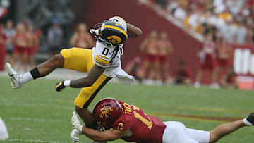 Iowa State Cyclones defensive back Beau Freyler (17) takes down Iowa Hawkeyes' wide receiver Diante Vines (0) during the fourth quarter.
