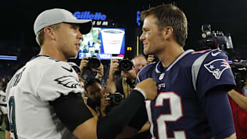 Aug 16, 2018; Foxborough, MA, USA; New England Patriots quarterback Tom Brady (12) meets Philadelphia Eagles quarterback Nick Foles (9) after the game at Gillette Stadium. Patriots defeated the Eagle 37-20. Mandatory Credit: David Butler II-Imagn Images