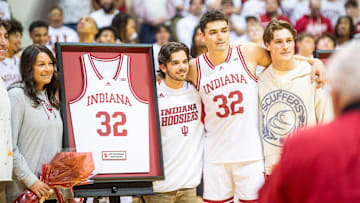 Indiana's Trey Galloway (32) poses with his family for Senior Day festivities after the Indiana versus Ohio State men's basketball game at Simon Skjodt Assembly Hall on Saturday, March 8, 2025.