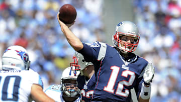 New England Patriots quarterback Tom Brady throws a touchdown pass over the Tennessee Titans defense at LP Field
