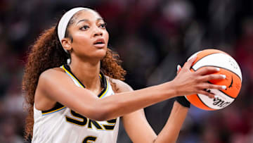 Angel Reese looks to shoot a basket during a game between the Indiana Fever and the Chicago Sky.
