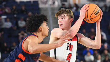 Harvard-Westlake's Nik Khamenia is guarded by Eastvale Roosevelt's Brayden Burries in the 2024 CIF Southern Section Open Division boys basketball final.