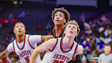 Jesuit's Asher Schroeder (22) and Maison Phillips (5) blocks out Chatsworth's Alijah Arenas during California (CIF) State Division 2 title game.
