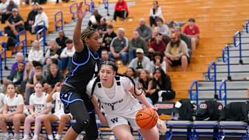 Jessie Moses of Westtown dribbles past a IMG Academy defender during the semifinals of the 2025 Chipotle Nationals in Indiana.