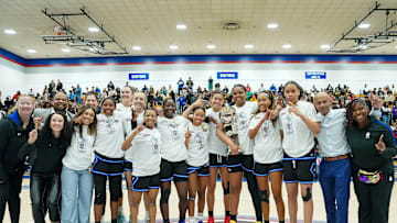 IMG Academy players and coaches pose after winning the 2025 Chipotle Nationals championship game in Indiana.