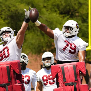 Arizona Cardinals defensive end Ben Stille (90) and Arizona Cardinals defensive tackle Phil Hoskins (79) during organized team activities at the Dignity Health Arizona Cardinals Training Center on May 28, 2024.