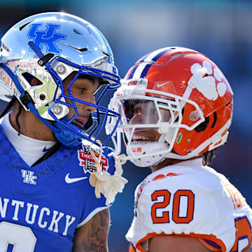 Kentucky Wildcats wide receiver Dane Key (6) carries Clemson Tigers cornerback Avieon Terrell (20) exchange words after Key took a long pass to the 5-yard line while being defended by Terrell during the first quarter. The Kentucky Wildcats faced off against the Clemson Tigers Friday, December 29, 2023, in the TaxSlayer Gator Bowl in Jacksonville, Florida. The Wildcats led 14 to 10 at the half. [Bob Self/Florida Times-Union]