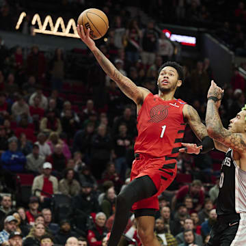 Dec 13, 2024; Portland, Oregon, USA; Portland Trail Blazers guard Anfernee Simons (1) scores a basket during the second half against San Antonio Spurs forward Jeremy Sochan (10) at Moda Center. Mandatory Credit: Troy Wayrynen-Imagn Images