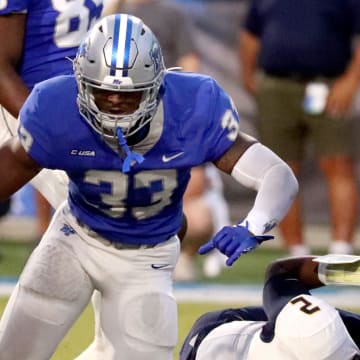 MTSU linebacker Sam Brumfield (33) celebrates sacking Murray State quarterback DJ Williams (2) during a football game at MTSU's Floyd Stadium on Saturday, Sept. 16, 2023.