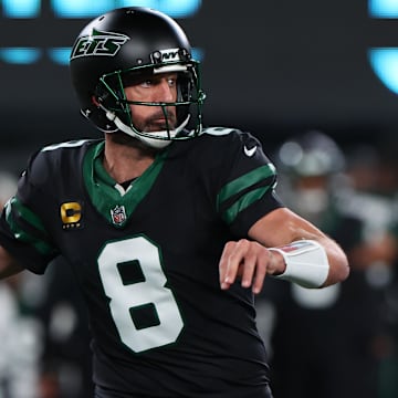 Oct 31, 2024; East Rutherford, New Jersey, USA; New York Jets quarterback Aaron Rodgers (8) throws a pass against the Houston Texans during the first half at MetLife Stadium. Mandatory Credit: Ed Mulholland-Imagn Images