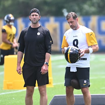 Jun 10, 2025; Pittsburgh, PA, USA;  Pittsburgh Steelers quarterback Aaron Rodgers (8) puts on his helmet during minicamp at their South Side facility. Mandatory Credit: Philip G. Pavely-Imagn Images