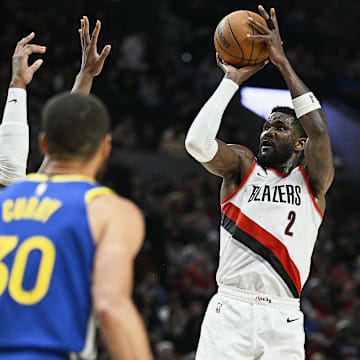 Apr 11, 2024; Portland, Oregon, USA; Portland Trail Blazers center Deandre Ayton (2) shoots a jump shot during the second half against the Golden State Warriors at Moda Center. Mandatory Credit: Troy Wayrynen-Imagn Images