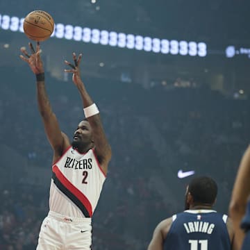 Dec 28, 2024; Portland, Oregon, USA; Portland Trail Blazers center Deandre Ayton (2) shoots a jump shot during the first half against Dallas Mavericks guard Kyrie Irving (11) at Moda Center. Mandatory Credit: Troy Wayrynen-Imagn Images