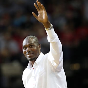 May 4, 2015; Houston, TX, USA; Former Houston Rockets Hakeem Olajuwon acknowledges the crowd during Los Angeles Clippers timeout in game one of the second round of the NBA Playoffs at Toyota Center. Los Angeles Clippers won 117 to 101. Mandatory Credit: Thomas B. Shea-Imagn Images