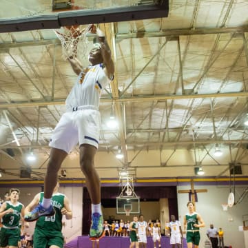 Keon Coleman #3 does a 360 degree dunk  during game at Opelousas Catholic. Tuesday, Jan. 26,