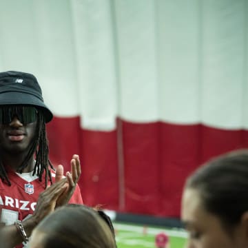 Marvin Harrison Jr. claps for the student athletes during the Cardinals girls flag football clinic at the Cardinals training facility on June 1, 2024 in Tempe, Ariz.