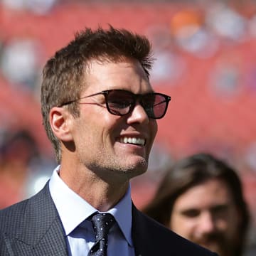 NFL legend Tom Brady is all smiles before an NFL football game at Huntington Bank Field, Sunday, Sept. 8, 2024, in Cleveland, Ohio.