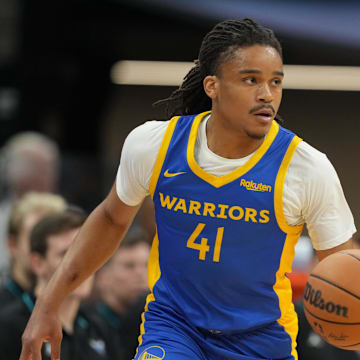 Jul 5, 2023; Sacramento, CA, USA; Golden State Warriors guard Yuri Collins (41) dribbles against the Charlotte Hornets during the first quarter at Golden 1 Center. Mandatory Credit: Darren Yamashita-Imagn Images