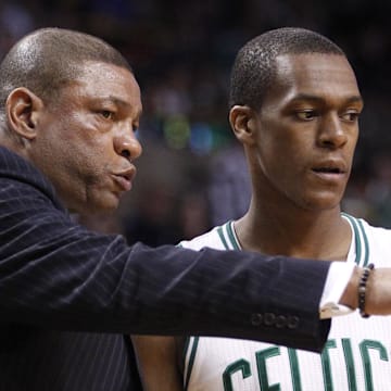 Apr 8, 2012; Boston, MA USA; Boston Celtics head coach Doc Rivers talks with point guard Rajon Rondo (9) from the sideline as they take on the Philadelphia 76ers in the second quarter at the TD Banknorth Garden. Mandatory Credit: David Butler II-Imagn Images