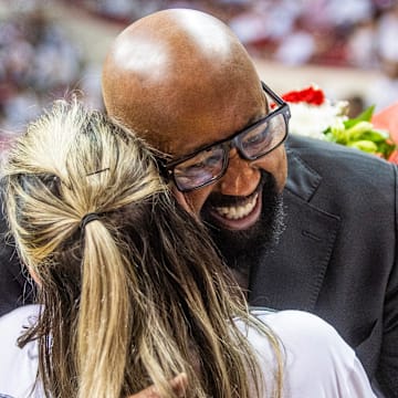 Indiana coach Mike Woodson gives a hug after the Hoosiers' final game at Assembly Hall on Saturday. It was his last home game as the IU coach after four years.
