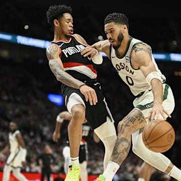 Mar 11, 2024; Portland, Oregon, USA; Boston Celtics forward Jayson Tatum (0) drives to the basket during the second half against Portland Trail Blazers guard Anfernee Simons (1) at Moda Center. Mandatory Credit: Troy Wayrynen-Imagn Images