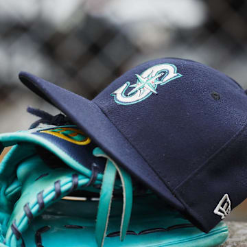 Hat and glove of Seattle Mariners center fielder Dee Gordon (9) sits in dugout during the third inning against the Detroit Tigers at Comerica Park in 2018. 
