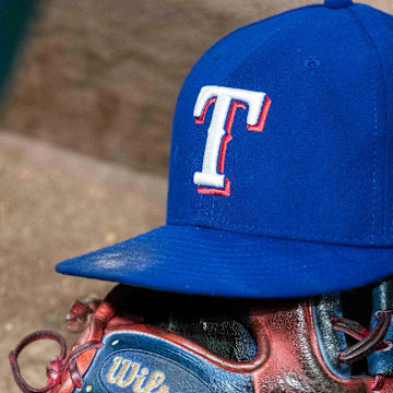 Jun 20, 2017; Arlington, TX, USA; A view of a Texas Rangers baseball hat and Wilson glove during the game between the Texas Rangers and the Toronto Blue Jays at Globe Life Park in Arlington.