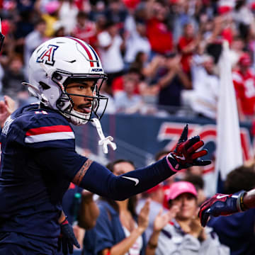 Oct 11, 2025; Tucson, Arizona, USA; Arizona Wildcats wide receiver Kris Hutson (4) celebrates a touchdown he made during the first quarter of the game against the Brigham Young Cougars at Arizona Stadium. Mandatory Credit: Aryanna Frank-Imagn Images